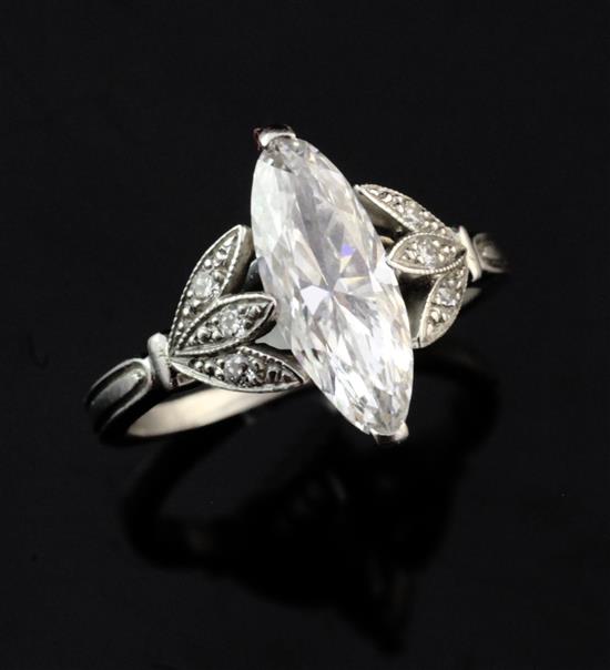 A good platinum and single stone marquise diamond ring, size I.